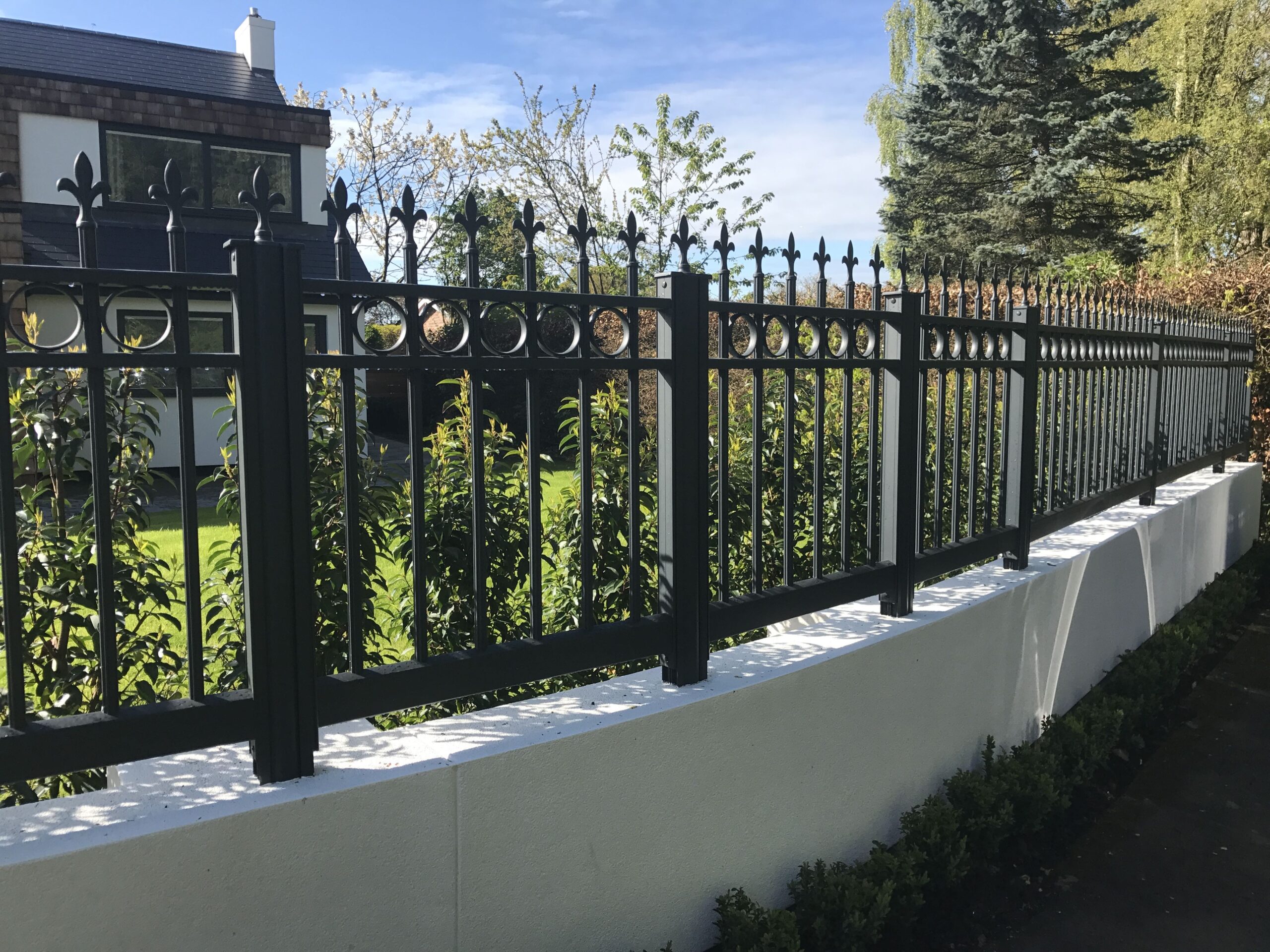 Aluminium fencing traditional style attached to white walls Aluminium Gates