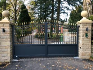 Traditional wrought iron aluminium gates in anthracite grey and gold decorative style