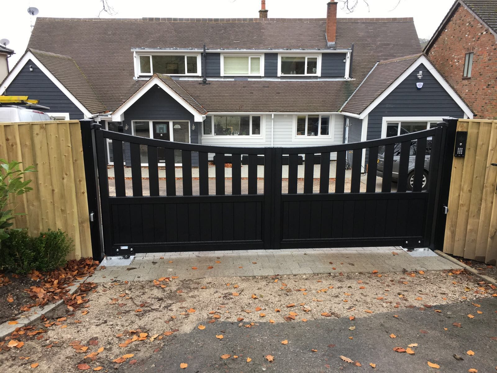 Semi open boarded aluminium gates fixed to softwood
