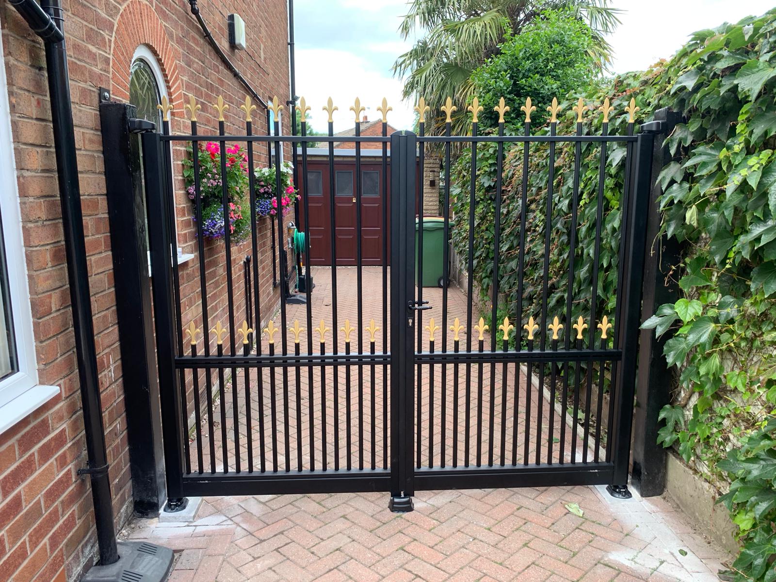double swing gates with black and gold colour manual pedestrian gates
